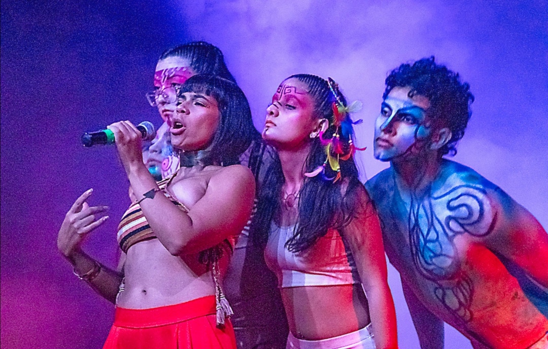 Academy performers singing on stage